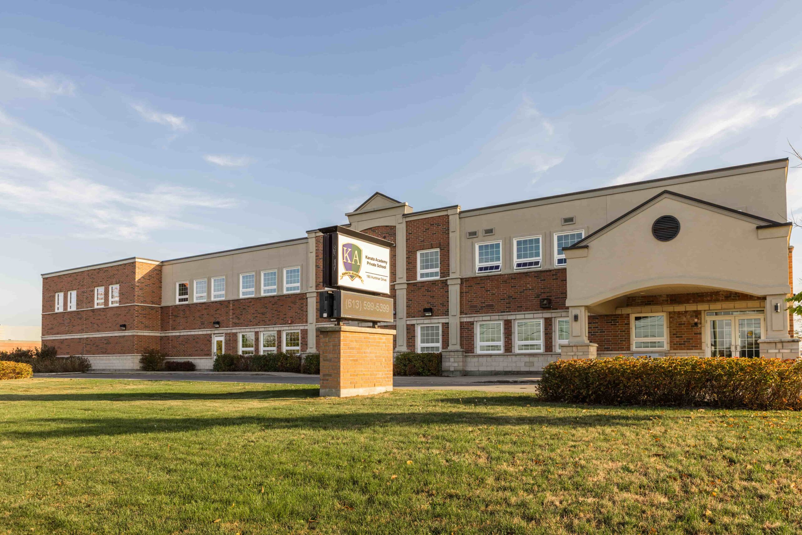 Exterior of the Kanata Academy Private School building with the KA sign visible at the entrance
